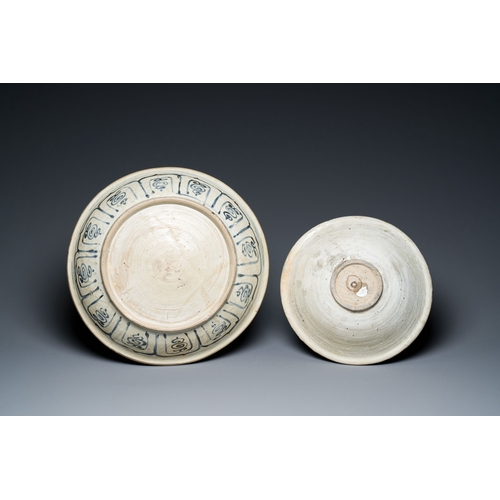 455 - A Vietnamese or Annamese blue and white dish, a Thai Sawankhalok dish and a pair of celadon figures,... 