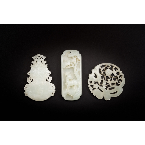 474 - Three Chinese celadon and white jade pendants, QingDescription:L.: 8 cm (the largest pendant)Conditi... 