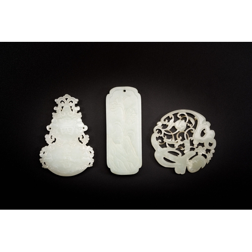 474 - Three Chinese celadon and white jade pendants, QingDescription:L.: 8 cm (the largest pendant)Conditi... 