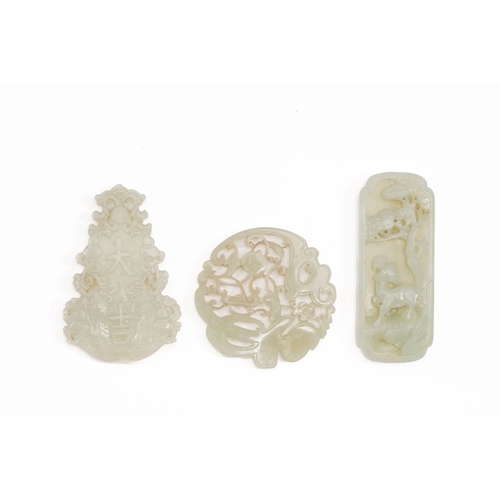 474 - Three Chinese celadon and white jade pendants, QingDescription:L.: 8 cm (the largest pendant)Conditi... 