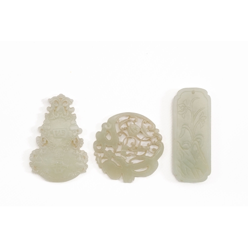 474 - Three Chinese celadon and white jade pendants, QingDescription:L.: 8 cm (the largest pendant)Conditi... 