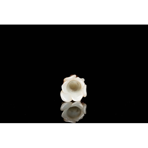 485 - A Chinese white jade 'magnolia' carving, QingDescription:H.: 8 cm (incl. glued stand) Provenance:- T... 