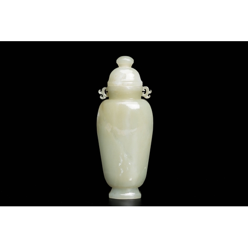 496 - A Chinese celadon jade vase and cover, QingDescription:H.: 20 cm (incl. the cover) Provenance:- The ... 