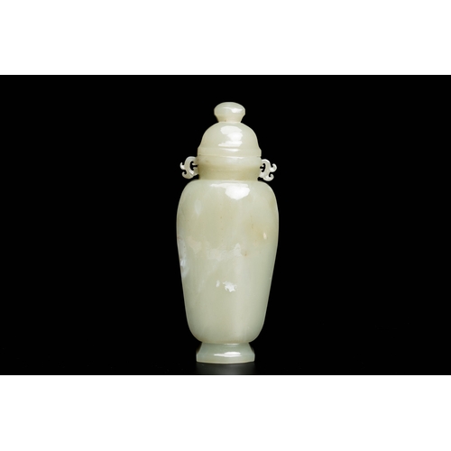 496 - A Chinese celadon jade vase and cover, QingDescription:H.: 20 cm (incl. the cover) Provenance:- The ... 