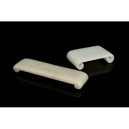 499 - Two fine Chinese white and celadon jade brush rests, QingDescription:Dim.: 13 x 3 x 1,5 cm (the long... 