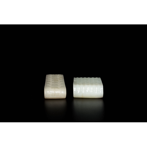 499 - Two fine Chinese white and celadon jade brush rests, QingDescription:Dim.: 13 x 3 x 1,5 cm (the long... 