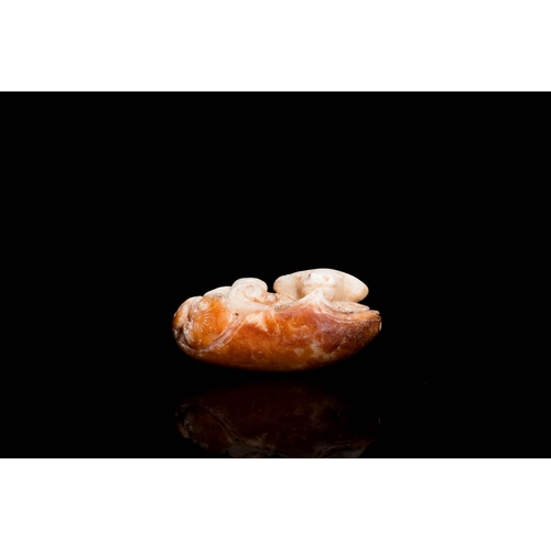 500 - A Chinese white and russet jade 'buffalo' pendant, 19th C.Description:Dim.: 7,5 x 5 x 3 cm Provenanc... 