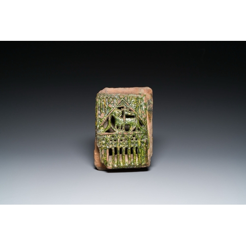 1030 - A green-glazed reticulated 'Agnus Dei' stove tile, Germany, 15th C.Description:Dim.: 28 x 19 x 8 cmC... 