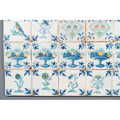 1108 - 30 polychrome Dutch Delft tiles with birds, flowers and tazzas with fruits, 17th C.Description:Dim.:... 