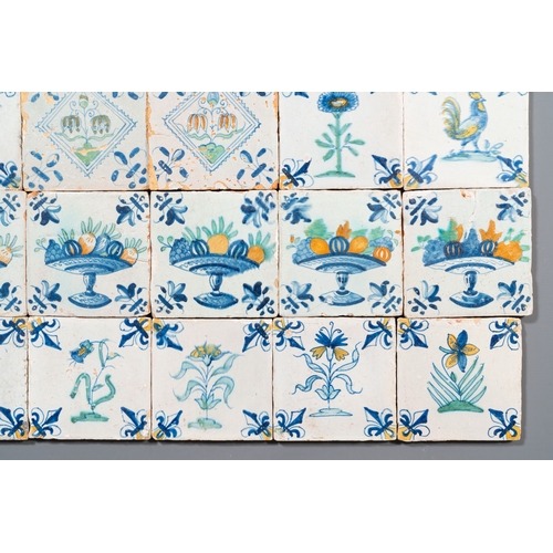 1108 - 30 polychrome Dutch Delft tiles with birds, flowers and tazzas with fruits, 17th C.Description:Dim.:... 