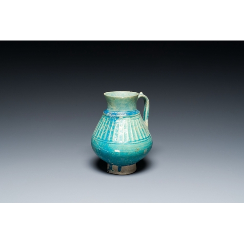 1114 - A turquoise-glazed jug, Kashan, Persia, 13th C.Description:H.: 18 cmCondition reports:Please contact... 