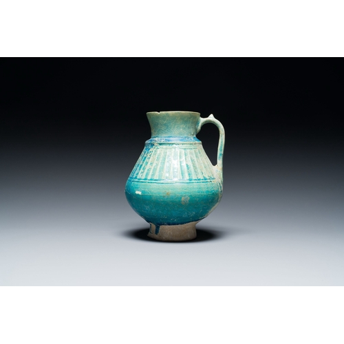 1114 - A turquoise-glazed jug, Kashan, Persia, 13th C.Description:H.: 18 cmCondition reports:Please contact... 