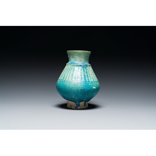 1114 - A turquoise-glazed jug, Kashan, Persia, 13th C.Description:H.: 18 cmCondition reports:Please contact... 