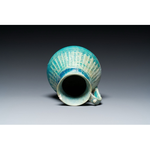 1114 - A turquoise-glazed jug, Kashan, Persia, 13th C.Description:H.: 18 cmCondition reports:Please contact... 