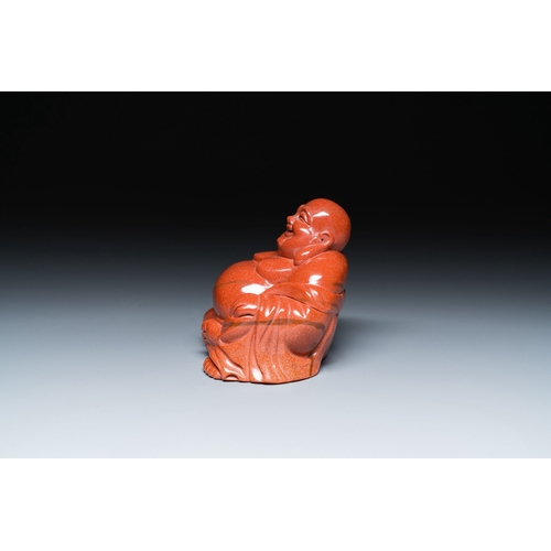 510 - A Chinese emerald green jadeite 'birds' group and a goldstone sculpture of Buddha, 19/20th C.Descrip... 