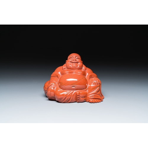 510 - A Chinese emerald green jadeite 'birds' group and a goldstone sculpture of Buddha, 19/20th C.Descrip... 