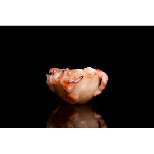 511 - A Chinese pink agate brush washer with a chilong, QingDescription:Dim.: 12 x 8,5 x 5 cm Provenance:-... 