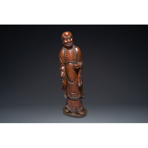 522 - A large Japanese polychromed and lacquered wood figure of Damo, Edo, dated 18/19th C.Description:H.:... 