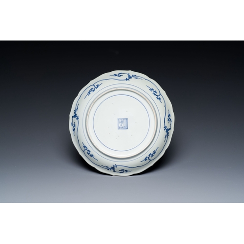 526 - A Japanese blue and white Arita dish with a tiger and a dragon in Kakiemon-style, Fuku mark, Edo, la... 