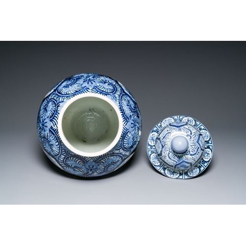 532 - A pair of Japanese Imari vases with flower-topped covers and a large blue and white Arita vase, Edo,... 