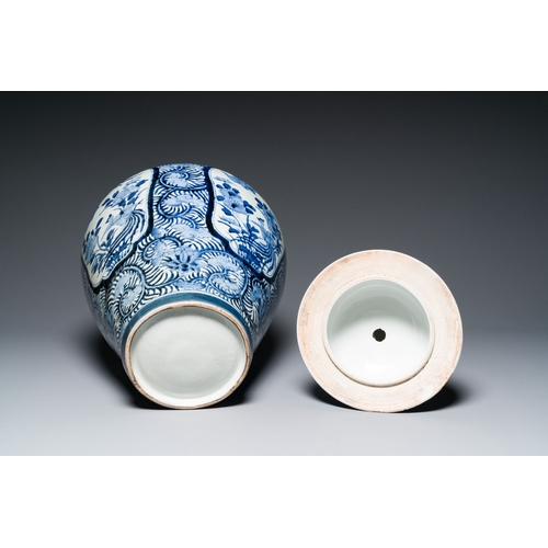 532 - A pair of Japanese Imari vases with flower-topped covers and a large blue and white Arita vase, Edo,... 