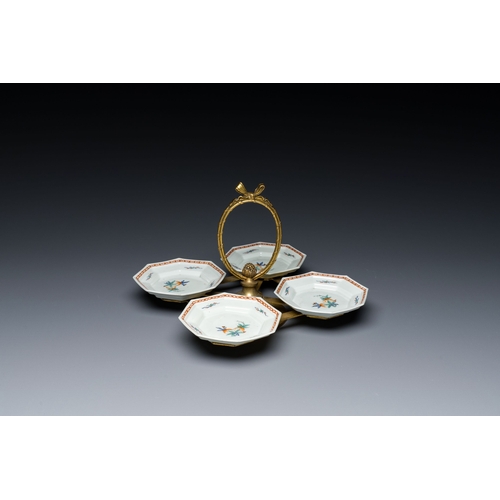 538 - Four Japanese Kakiemon-style octagonal dishes in a brass mount, Edo, 18th C.Description:Dim.: 23 x 2... 