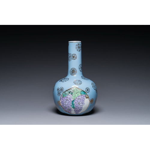 545 - A Chinese lavender blue-ground bottle vase with fruit medallions, RepublicDescription:H.: 30,5 cmCon... 