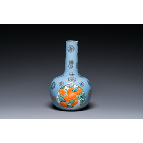 545 - A Chinese lavender blue-ground bottle vase with fruit medallions, RepublicDescription:H.: 30,5 cmCon... 