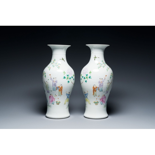 566 - A pair of Chinese famille rose 'playing boys' vases, Qianlong mark, RepublicDescription:H.: 44,5 cmC... 