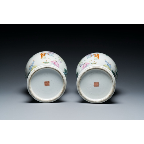 566 - A pair of Chinese famille rose 'playing boys' vases, Qianlong mark, RepublicDescription:H.: 44,5 cmC... 