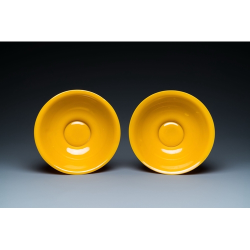 578 - A pair of Chinese yellow Beijing glass bowls with figures in mountainous landscapes, 19/20th C.Descr... 