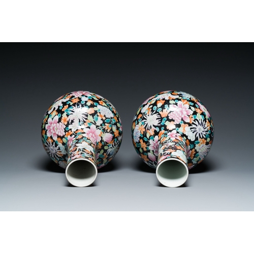 581 - A pair of Chinese famille rose black-ground millefleurs bottle vases, Qianlong mark, RepublicDescrip... 