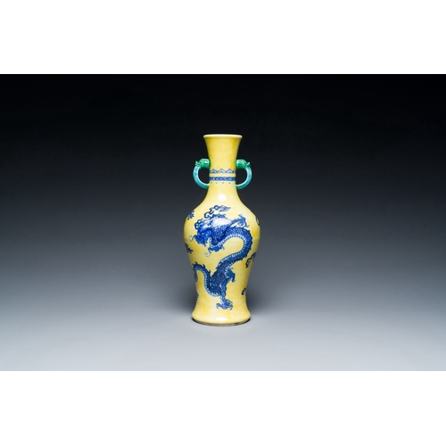 594 - A Chinese blue and white yellow-ground 'dragon' vase with green-glazed handles on a jade-inset woode... 