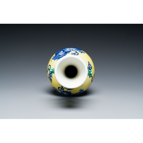 594 - A Chinese blue and white yellow-ground 'dragon' vase with green-glazed handles on a jade-inset woode... 