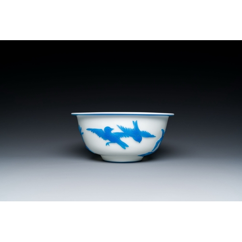 595 - A fine Chinese overlay Beijing glass bowl with birds and flowers in blue on white, 19/20th C.Descrip... 