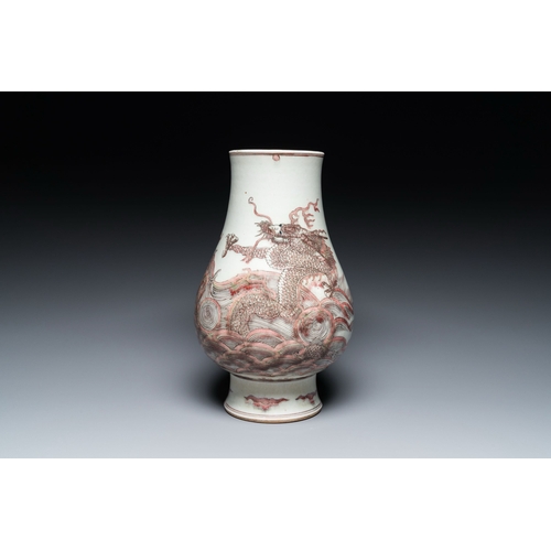 653 - A Chinese copper-red 'dragon and carp' vase, Kangxi mark, 20th C.Description:H.: 30 cm Provenance:- ... 