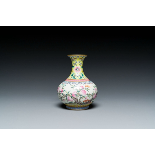 667 - A small Chinese famille rose 'nine peaches' bottle vase, Jiaqing mark, 20th C.Description:H.: 12 cmC... 