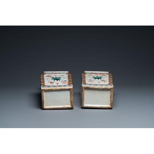 691 - A pair of rectangular Chinese famille rose relief-molded vases, 19th C.Description:H.: 42,5 cm Condi... 