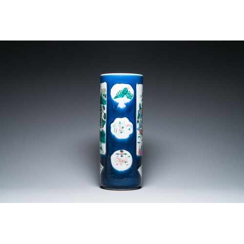 712 - A large Chinese blue-ground famille rose cylindrical vase, 19th C.Description:H.: 61,5 cmCondition r... 