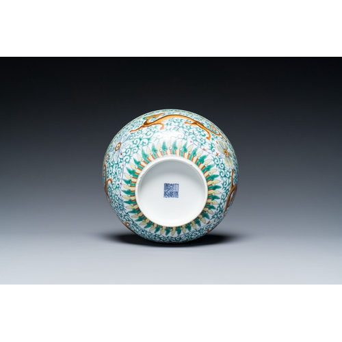 719 - A Chinese doucai 'dragons' bowl, Jiaqing mark, 19th C.Description:Dia.: 20,5 - H.: 8,5 cm Provenance... 