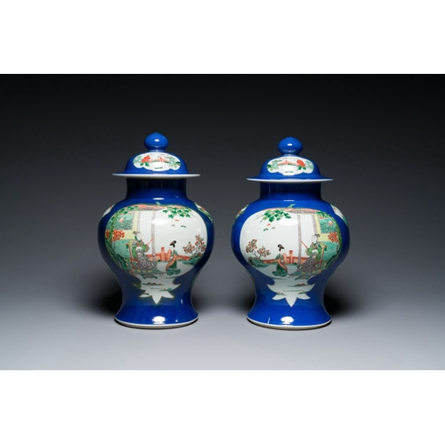 723 - A pair of Chinese powder-blue-ground famille verte vases and covers, 19th C.Description:H.: 40,5 cmC... 