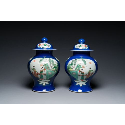 723 - A pair of Chinese powder-blue-ground famille verte vases and covers, 19th C.Description:H.: 40,5 cmC... 