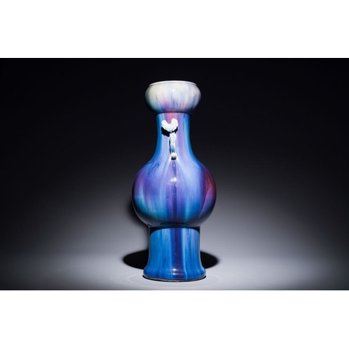 153 - A Chinese flambe-glazed garlic-mouth vase with ruyi handles, 19th C.H.: 57 cm
 Provenance: The colle... 