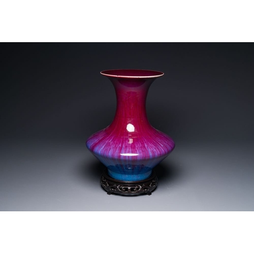 157 - A Chinese flambe-glazed vase on a wooden base, 19th C.H.: 42,5 cm (incl. stand)H.: 37,5 cm (the vase... 