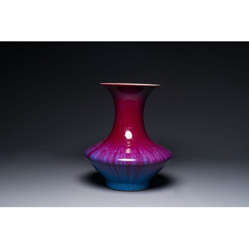 157 - A Chinese flambe-glazed vase on a wooden base, 19th C.H.: 42,5 cm (incl. stand)H.: 37,5 cm (the vase... 