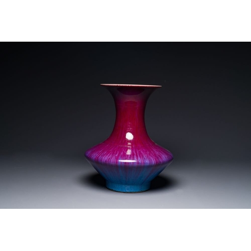 157 - A Chinese flambe-glazed vase on a wooden base, 19th C.H.: 42,5 cm (incl. stand)H.: 37,5 cm (the vase... 