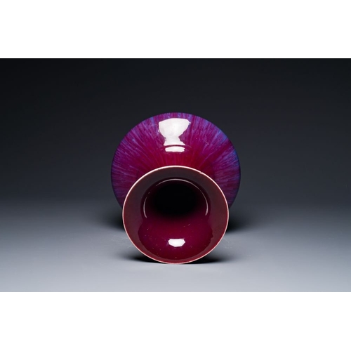 157 - A Chinese flambe-glazed vase on a wooden base, 19th C.H.: 42,5 cm (incl. stand)H.: 37,5 cm (the vase... 