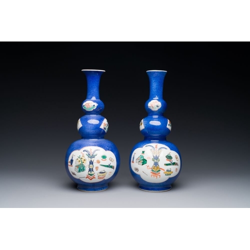 162 - A pair of Chinese famille verte powder-blue-ground triple gourd 'antiquities' vases, KangxiH.: 27,3 ... 