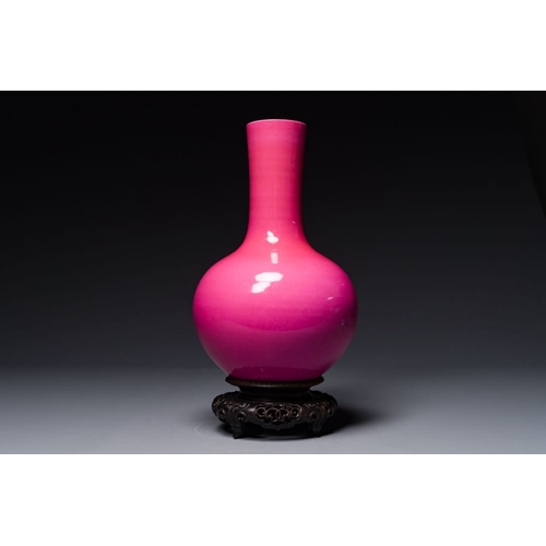 170 - A Chinese monochrome ruby-pink-glazed 'tianqiuping' vase on wooden stand, Yongzheng mark, 19/20th C.... 