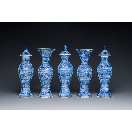 292 - A Chinese blue and white garniture of five vases with floral design, KangxiH.: 32 cm (the three vase... 